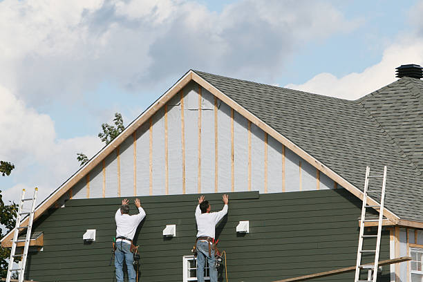 Professional Siding Installation technician working in Holtsville, NY